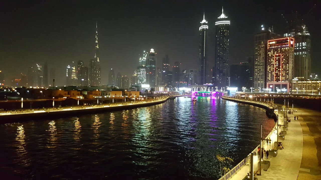 Dubai Water Canal at night with Downtown skyline, where several branded residences in Dubai are located