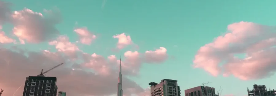 Dubai business setup cost: Business Bay skyline with the Burj Khalifa at dusk