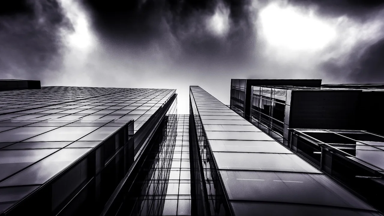Dubai dual licence: glass office facade representing a free zone company expanding to the mainland