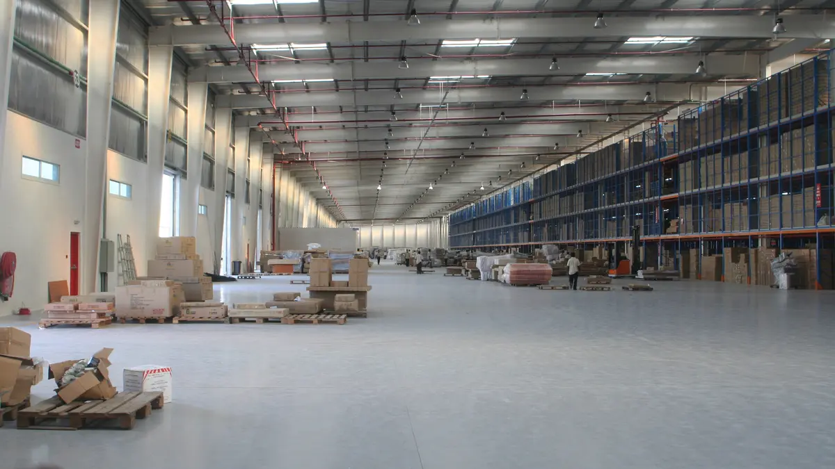 Interior of a warehouse in Dubai at Jebel Ali with pallet racking and stored cargo