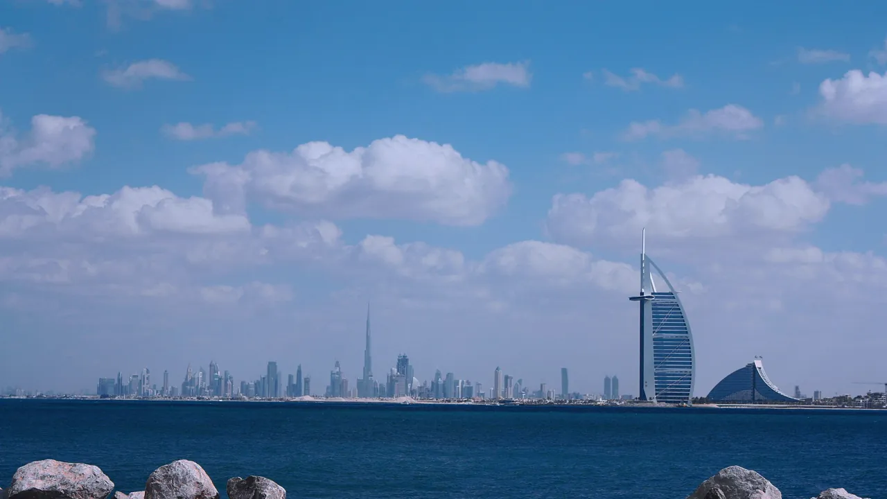Dubai coastline skyline with Burj Al Arab, a backdrop for the Oqood vs title deed question for off-plan buyers
