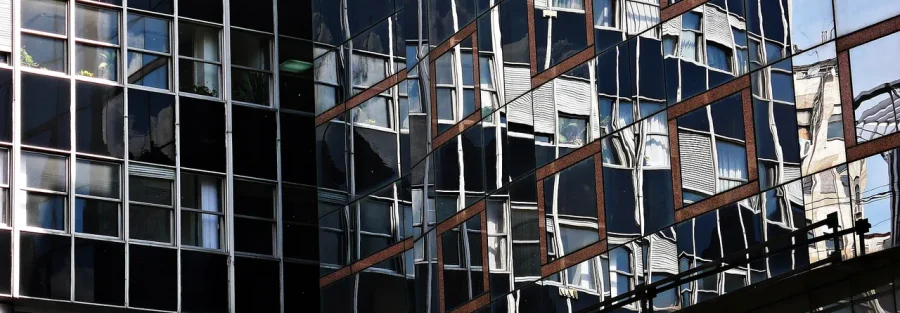 Glass office building where a foreign company could create a permanent establishment UAE tax presence