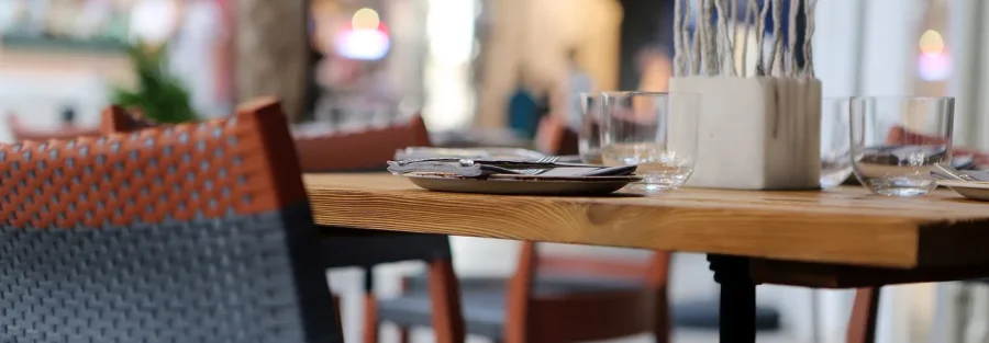 Restaurant table set for a business meal, the kind of client hospitality that is only 50% deductible in UAE corporate tax deductible expenses