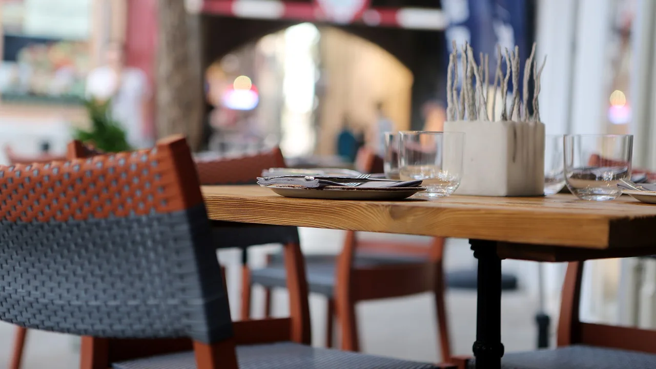 Restaurant table set for a business meal, the kind of client hospitality that is only 50% deductible in UAE corporate tax deductible expenses