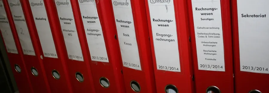 UAE tax audit records: red accounting binders for invoices, bank and payroll files