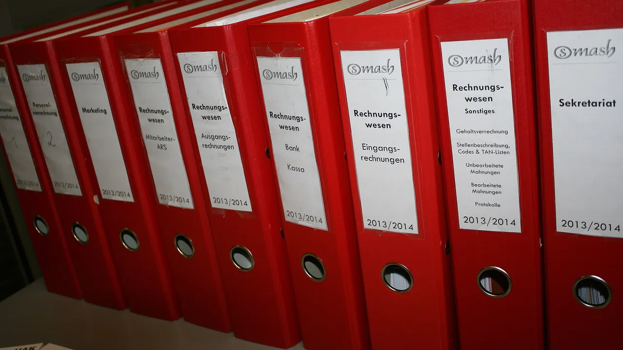 UAE tax audit records: red accounting binders for invoices, bank and payroll files